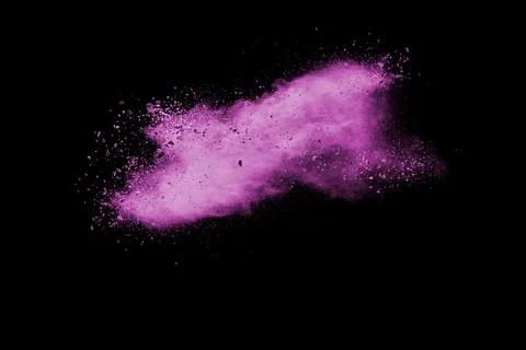 Pink dust particles splash on black background.Pink powder splash. Stock Photos