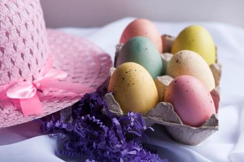 Pink Easter Bonnet and Easter Eggs in carton Stock Photos