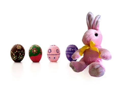 Pink Easter Bunny and painted eggs Stock Photos