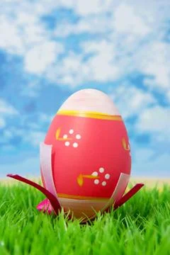 Pink easter egg on grass Stock Photos