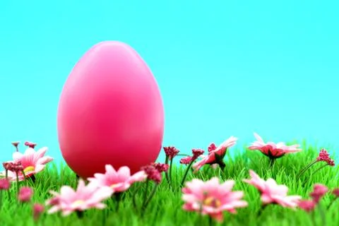 Pink easter egg on meadow with flowers &amp; cyan background Фото