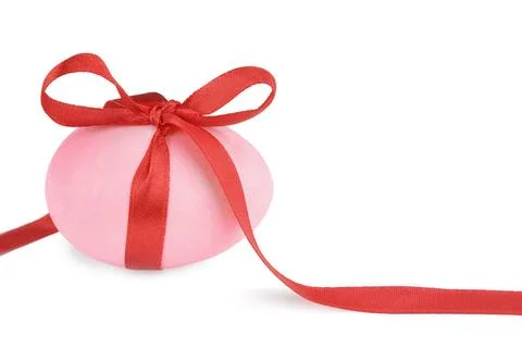 Pink Easter egg Pink Easter egg with a red ribbon isolated on white backgr... Stock Photos