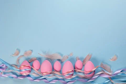 Pink Easter eggs on a blue background Stock Photos