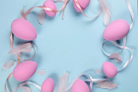 Pink Easter eggs on a blue background Stock Photos