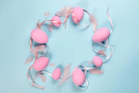 Pink Easter eggs on a blue background Stock Photos