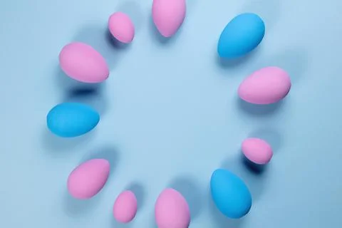 Pink Easter eggs on a blue background Stock Photos