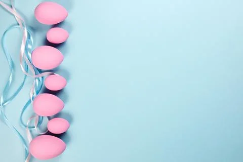 Pink Easter eggs on a blue background Stock Photos