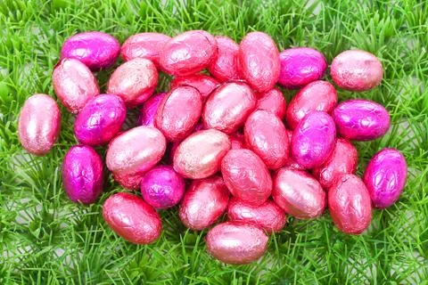 Pink easter eggs on grass Stock Photos