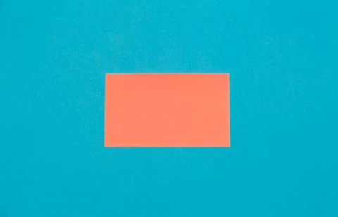 Pink empty paper square stickers on blue background, copy space Stock Photos