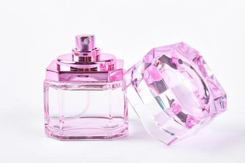Pink empty perfume container. Stock Photos