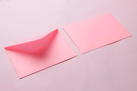 Pink envelope with a blank for text on a bright trendy pink background. free Stock Photos