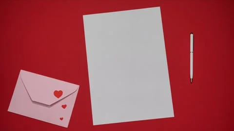Pink envelope opens and a white sheet of paper appears. Stop motion Video stock 320875261