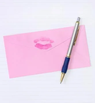 Pink envelope with a pen Stock Photos