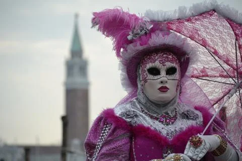 Pink female mask and costume at Venice Carnival Stock Photos
