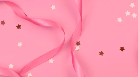 Pink festive delicate pastel background with satin ribbons, the concept of the Stock Footage 246031412