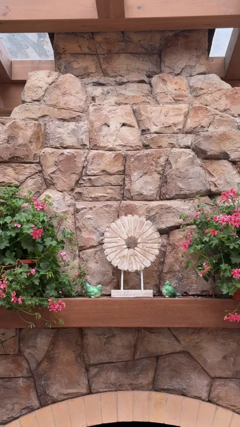 Pink Floral Decor on Rustic Stone Fireplace Mantel in Luxury Gazebo Vídeo Stock 334887052