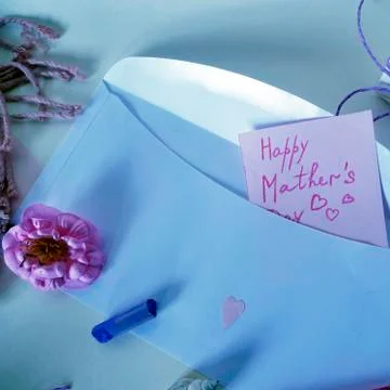Pink flower, notepad and postcard to mother's day on a light background Stock Photos