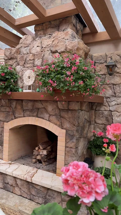 Pink Flowers and Rustic Fireplace in Luxury Summer Gazebo Vídeo Stock 334887059
