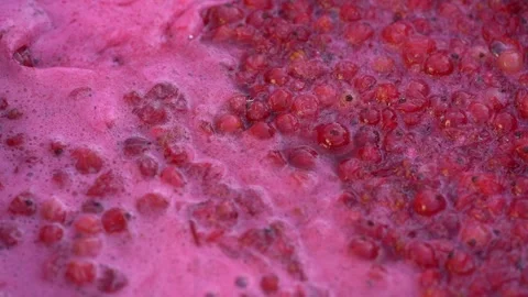 Pink foam for red currant jam. red currant are boiled in a pot with sugar. Stock Footage 279111647