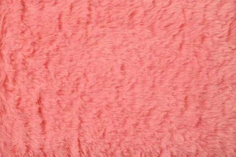 Pink fur background close-up. View from above. Stock Photos