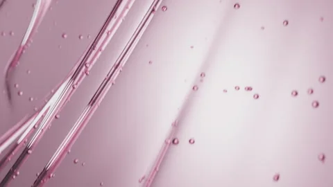 Pink gel flow texture. Rose serum toner or oil. Liquid gel moisturizer with Stock Footage 247738696