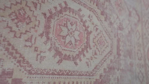 Pink geometric carpet showcasing soft textile texture Stock Footage 298367809
