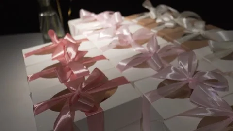Pink gift boxes with ribbons and bows in pastel colors. Stock Footage 249964675