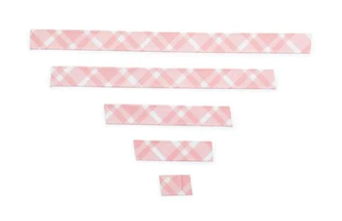 Pink gingham patterned washi tape strips in various lengths, crafting and dec Stock Photos