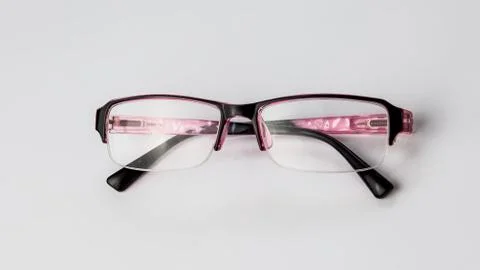 Pink Glasses for vision on a light background. Stock Photos