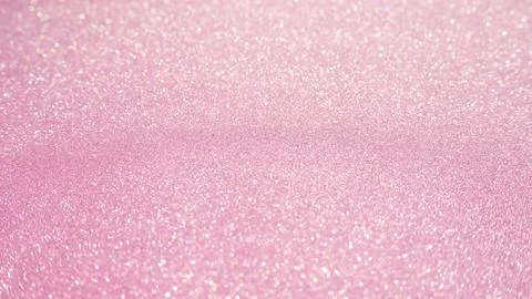 Pink glitter for an abstract background, selective focus. Stock Photos
