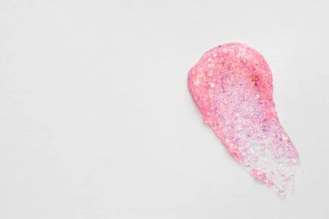 Pink glitter stroke on grey background Stock Photos