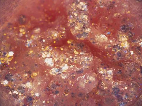 Pink glitter texture, small multi-colored decorative sequins for festive make Stock Photos