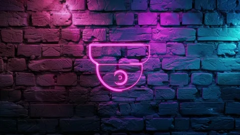 Pink glowing Dome camera, cctv sign neon icon on brick wall background Stock Footage 275511891