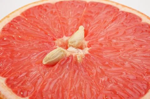 Pink grapefruit half close-up Stock Photos