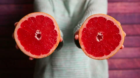 Pink grapefruit or pomelo, hand with tropical citrus fruit as healthy food Stock-Footage 100854217