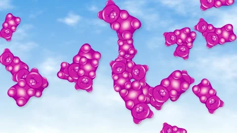 Pink Gummy Bear Candy Falling Through a Blue Cloudy Sky Stock Footage 345125041