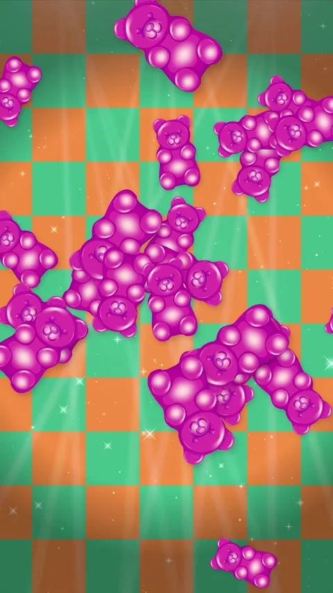 Pink Gummy Bears Falling Over Green and Orange Checkerboard Background Stock Footage 345206589