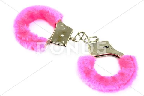 Pink handcuffs toy. Stock Photos