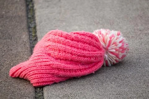 A pink hat on the ground Stock Photos