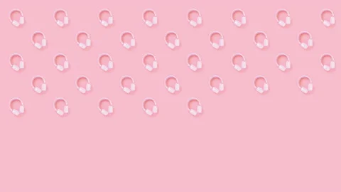Pink headphones on a pink background. Pattern. Stock Footage 148645964