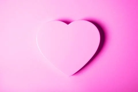 Pink heart on gradient background. Stock Photos