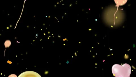 Pink heart-shaped balloon floating with gold confetti in dark studio setting Stock Footage 345864841