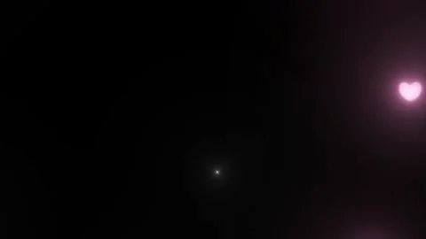 Pink heart shaped lights floating in dark space 動画素材 337465534