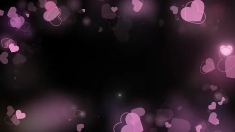 Pink hearts float gently on black background Stock Footage 337465621