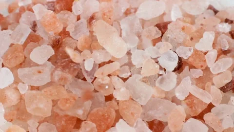 Pink Himalayan salt falling down close up Stock Footage 226797502