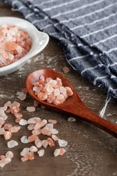 Pink himalayan salt on rustic background Stock Photos