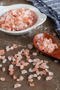 Pink himalayan salt on rustic background Stock Photos