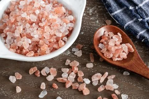 Pink himalayan salt on rustic background Stock Photos
