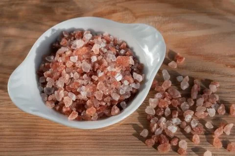 Pink himalayan salt on rustic background Stock Photos