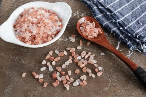 Pink himalayan salt on rustic background Stock Photos